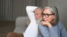 Unhappy senior woman looking away from her partner 