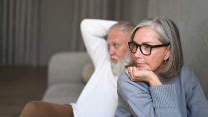 Unhappy senior woman looking away from her partner 