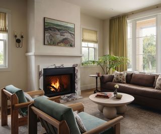 cozy neutral living room with marble fireplace and eclcetlic decor