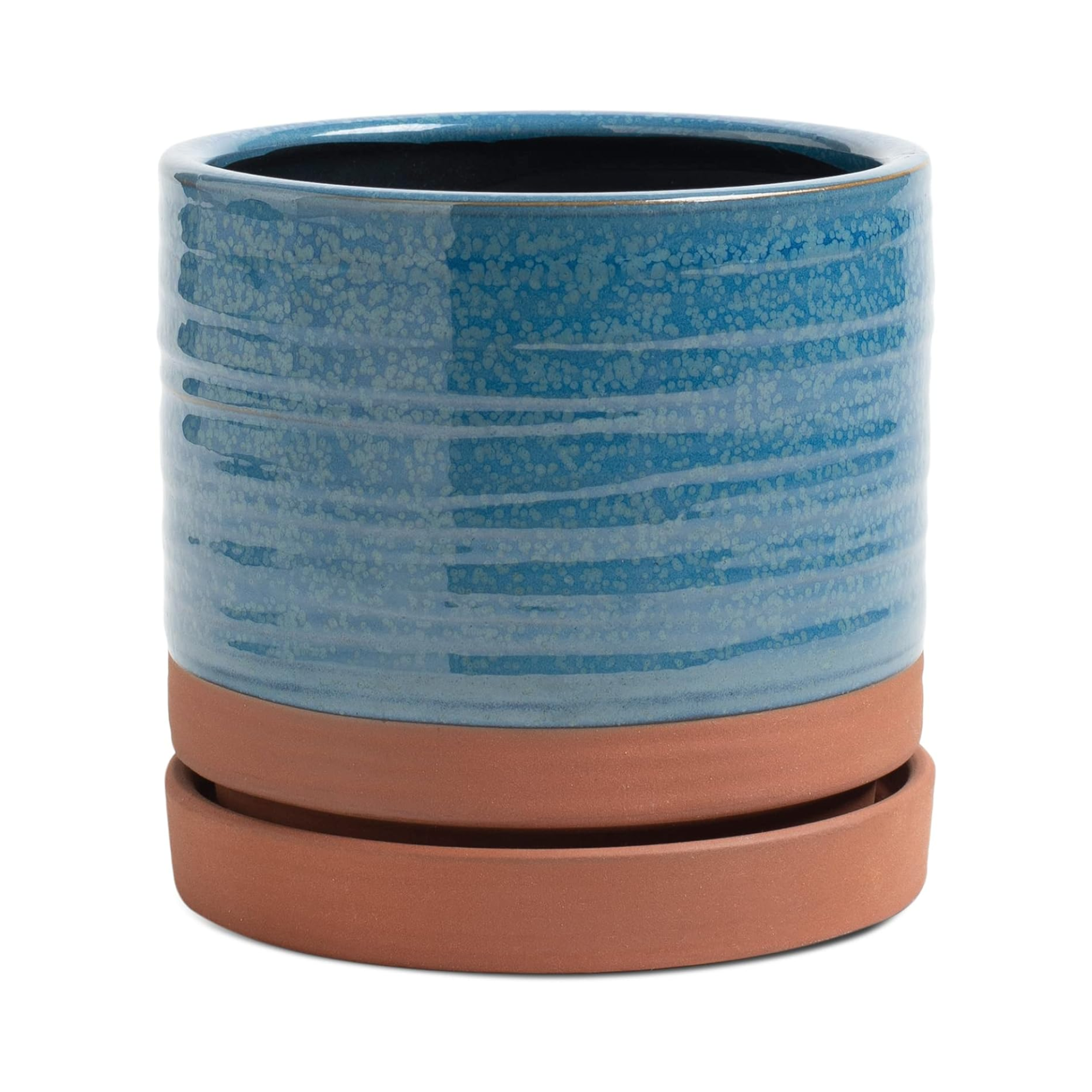 A clay planter with blue glaze