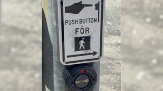 A screenshot from a video showing a hacked crosswalk button in Silicon Valley