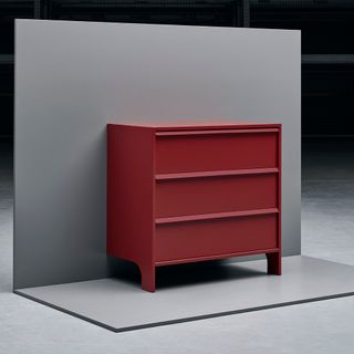 ikea red cabinet with drawers and black and grey background