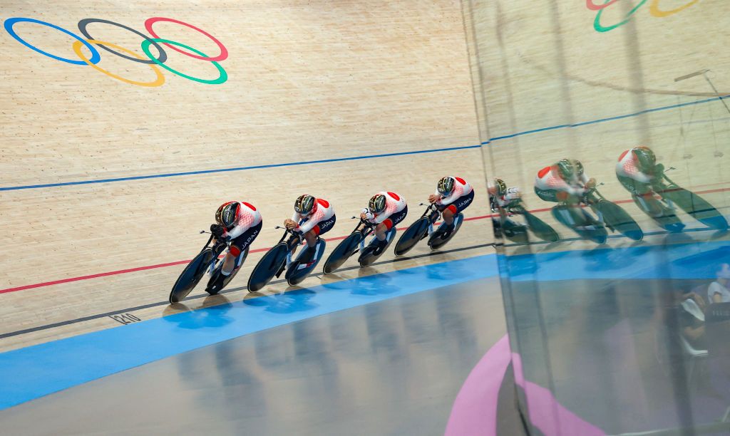 Japan's Yumi Kajihara, Japan's Tsuyaka Uchino, Japan's Mizuki Ikeda and Japan's Maho Kakita compete in a women's track cycling team pursuit qualifying round of the Paris 2024 Olympic Games at the Saint-Quentin-en-Yvelines National Velodrome in Montigny-le-Bretonneux, south-west of Paris, on August 6, 2024. (Photo by Thomas SAMSON / AFP)