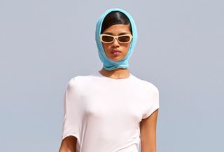 Model wearing turquoise on the runway at the Jacquemus fall/winter 2024 show.