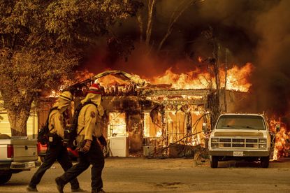 A house burns in Doyle, California.