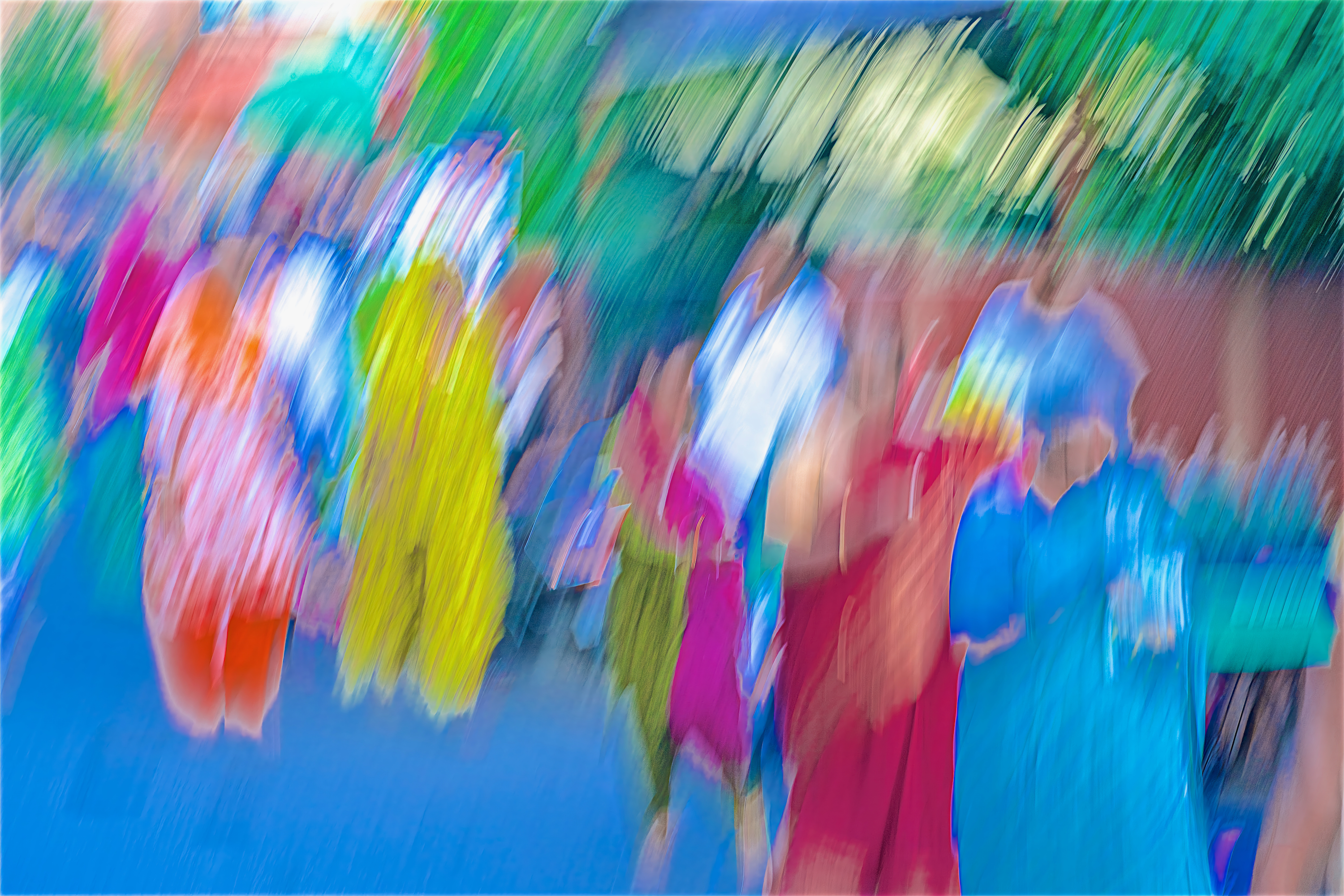 A vibrant, impressionistic array of vertical color streaks in blue, yellow, and red, capturing the blurred movement of a crowded street in India.