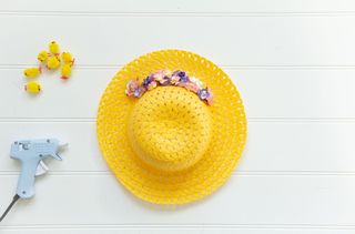 Add the small paper flowers to the easy DIY Easter bonnet