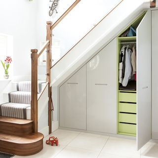 stairs cabinet with hanging space and drawers
