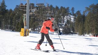 A beginner skier practicing the wedge turn
