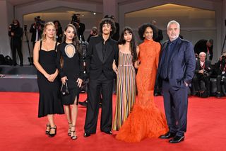 Director Luc Besson with his wife Virginie Silla and their children Sateen Besson, Mao Besson, Thalia Besson and Shanna Besson attend a red carpet for the movie "Dogman" at the 80th Venice International Film Festival on August 31, 2023 in Venice, Italy.