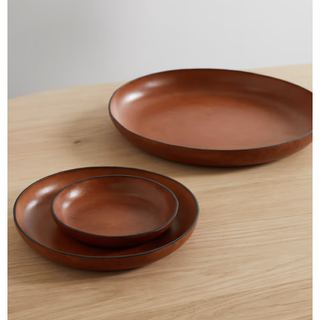 three round brown leather trays