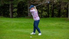 Carly Frost hitting a tee shot