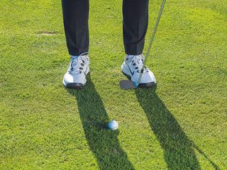 Gary Munro demonstrating stance width for an 80-yard pitch shot