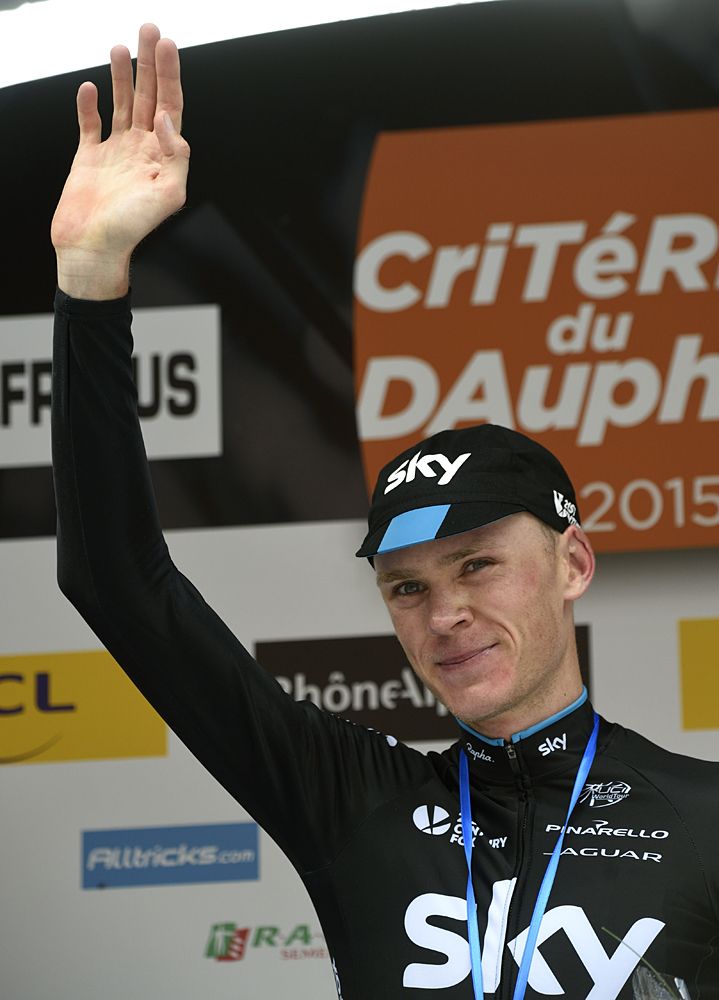 Chris Froome (Team Sky) waves to the crowd from the finale podium