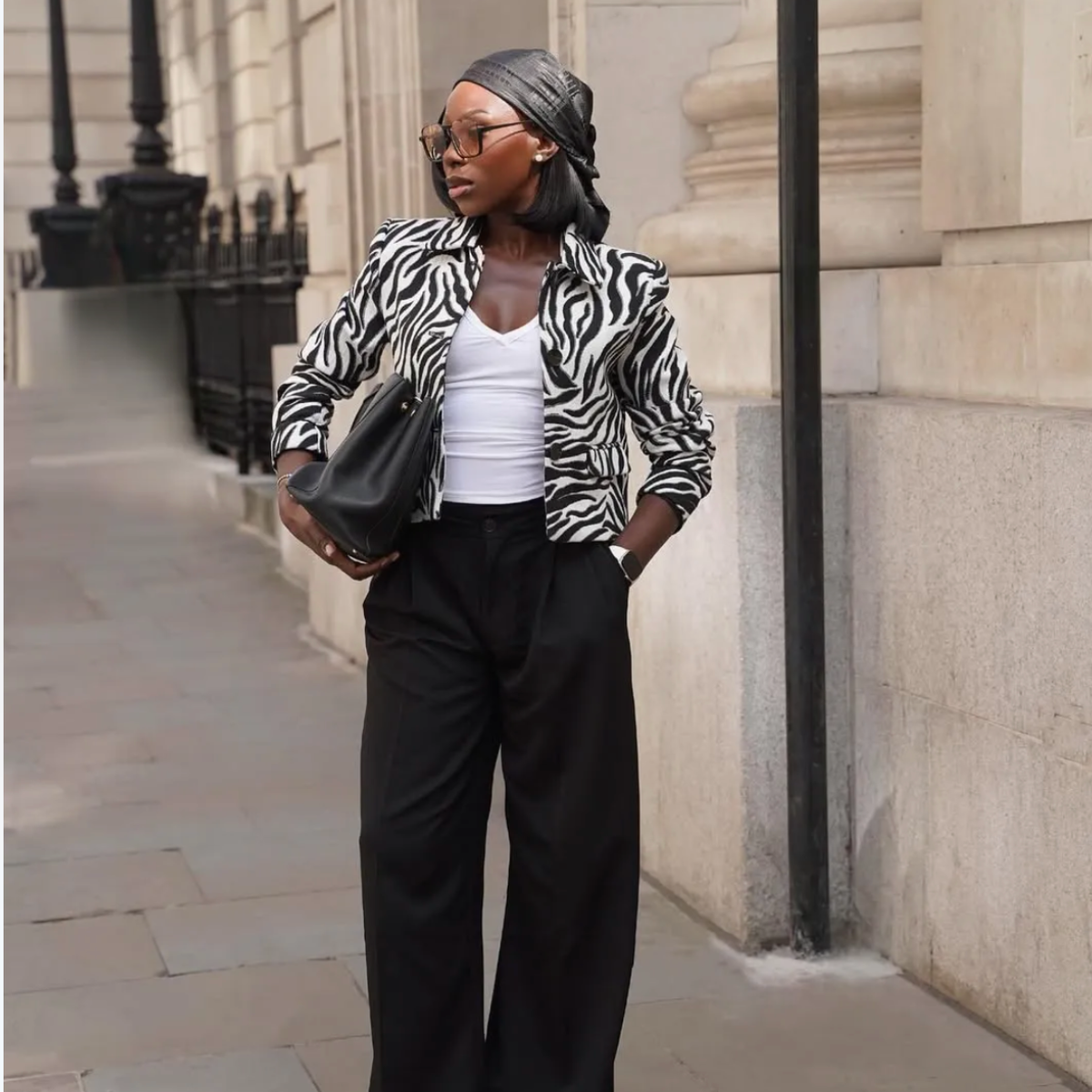 @amagodson_a wears zebra print jacket and black trousers
