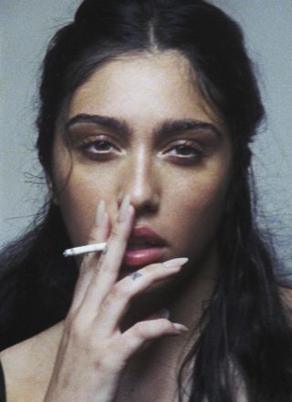 Lourdes Leon smoking a cigarette