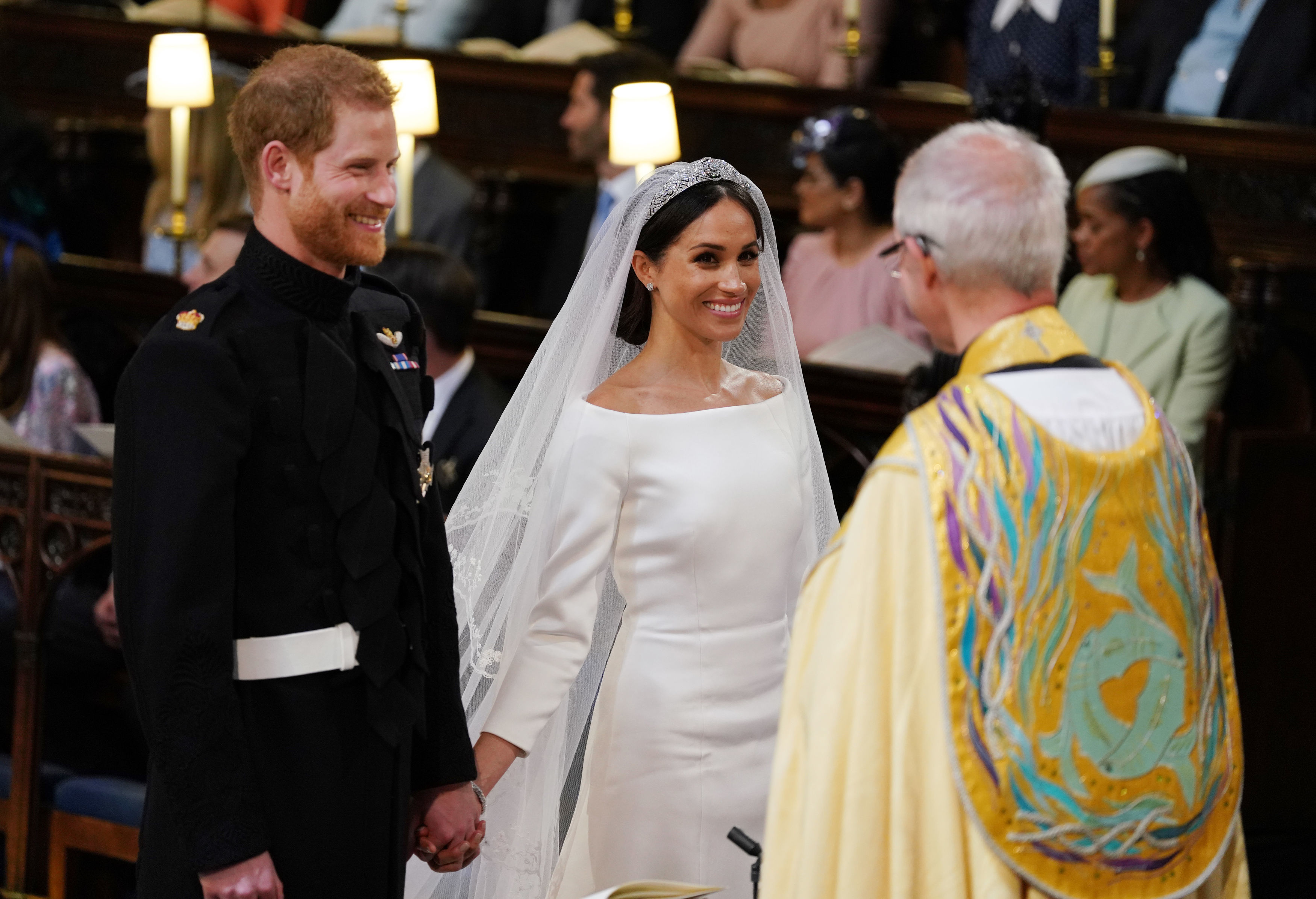 Prince Harry and Meghan Markle smiling during their wedding reception