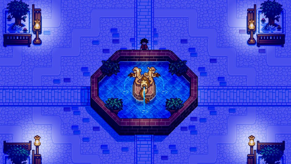 A screenshot from Haunted Chocolatier, showing a town square fountain at night.