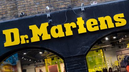 Dr Martens logo and branding pictured on a store front on on Neal Street in Covent Garden, London.
