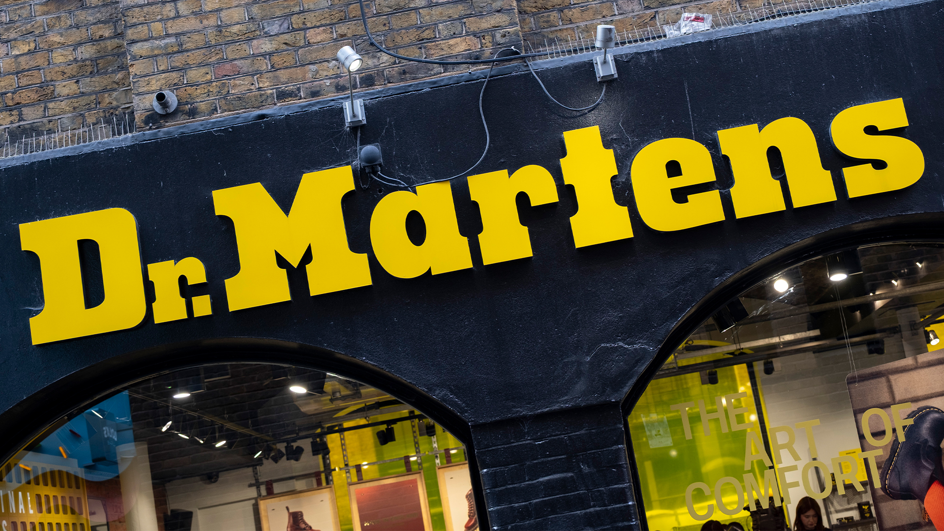 Dr Martens logo and branding pictured on a store front on on Neal Street in Covent Garden, London.
