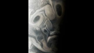 The swirling clouds of Jupiter forming a face