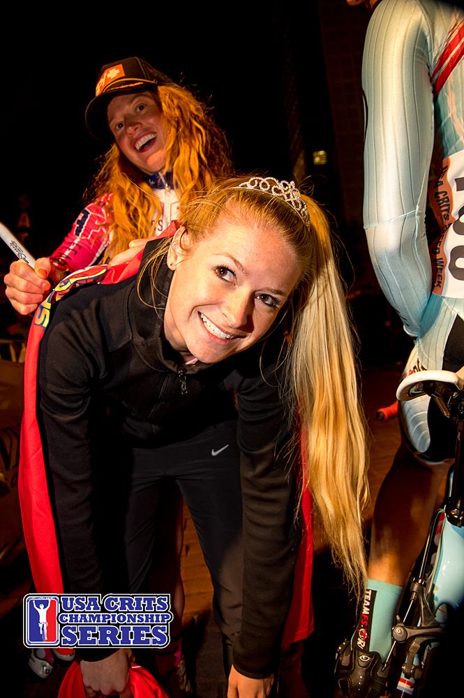 Fearless Femme rider Christy Keely finds a use for the podium girl as a desk to autograph a jersey