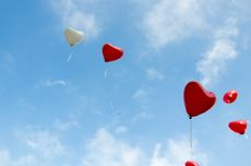 Heart-shaped balloons in the sky