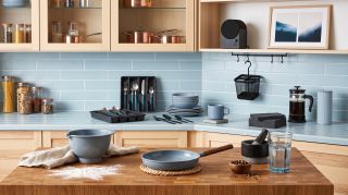 Kitchen with assortment of IKEA accessories in black and duck egg blue
