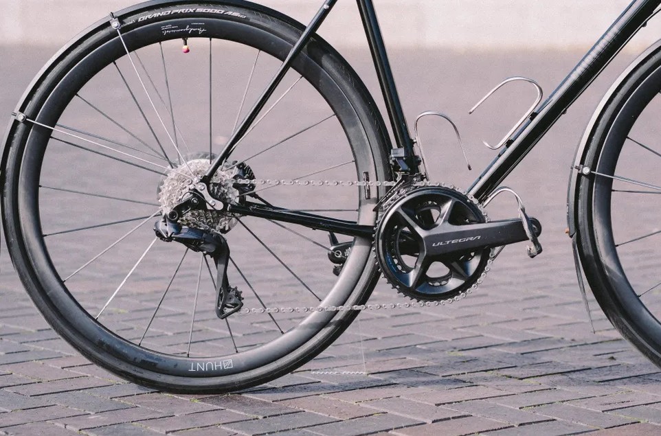 A black roadbike with mudguards fitted