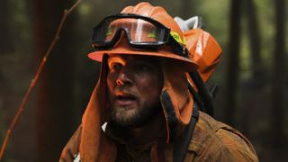 Max Thieriot as Bode Donovan in firefighting gear in Fire Country