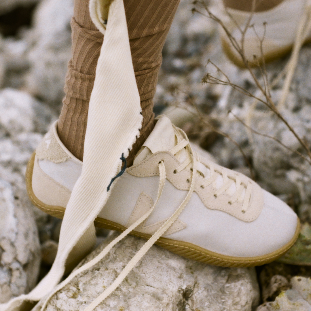 a model wearing the veja x baserange sneaker