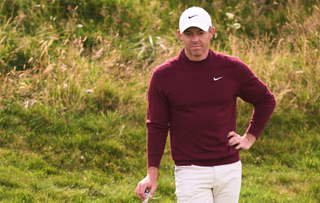 Rory McIlroy with his hand on his hip