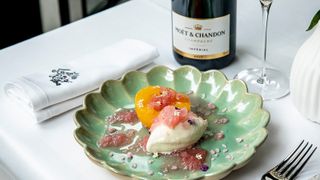 Moët in Paris by Allenos: dessert and bottle of champagne on table