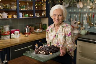 Mary shows off her yule log.