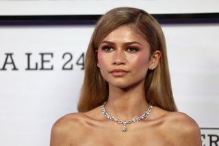 Zendaya wears a white strapless gown to the 'Challengers' premiere in Paris with a stunning diamond choker