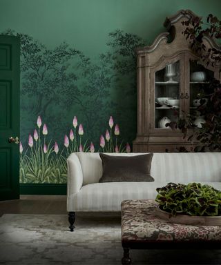 Green wallpaper, black trees and pink flowers