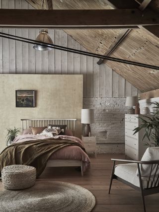 wooden flooring in a bedroom with vaulted ceiling