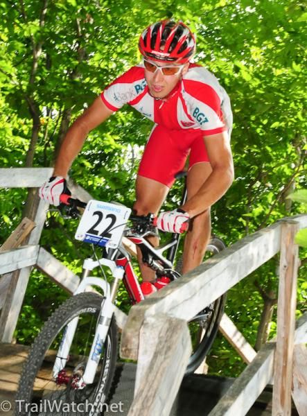 Piotr Brzozka (Poland) crosses a bridge before the big switchback climb
