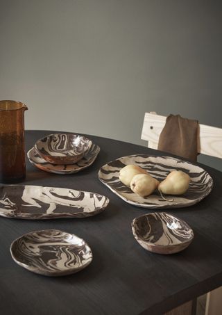 A dinner table with irregular dinnerware
