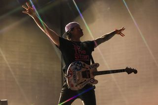 A picture of Tom DeLonge performing live with Blink-182 in 2023