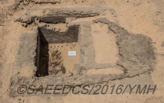 A cemetery containing at least 15 burials was found beside the remains of the ancient Abydos city. One of the tombs (shown here) holds the remains of at least one person in a fetal position. The grave would have been covered with a building (remains shown