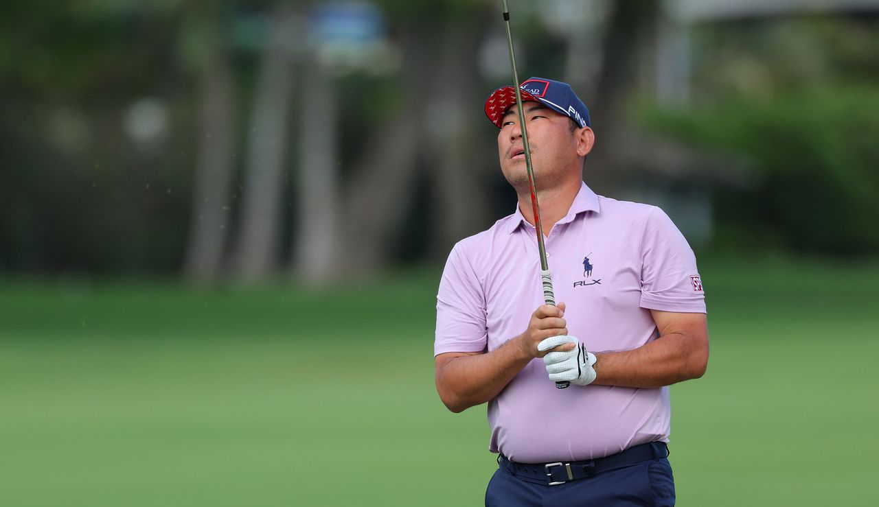 Chan Kim looks to the sky whilst holding a golf club