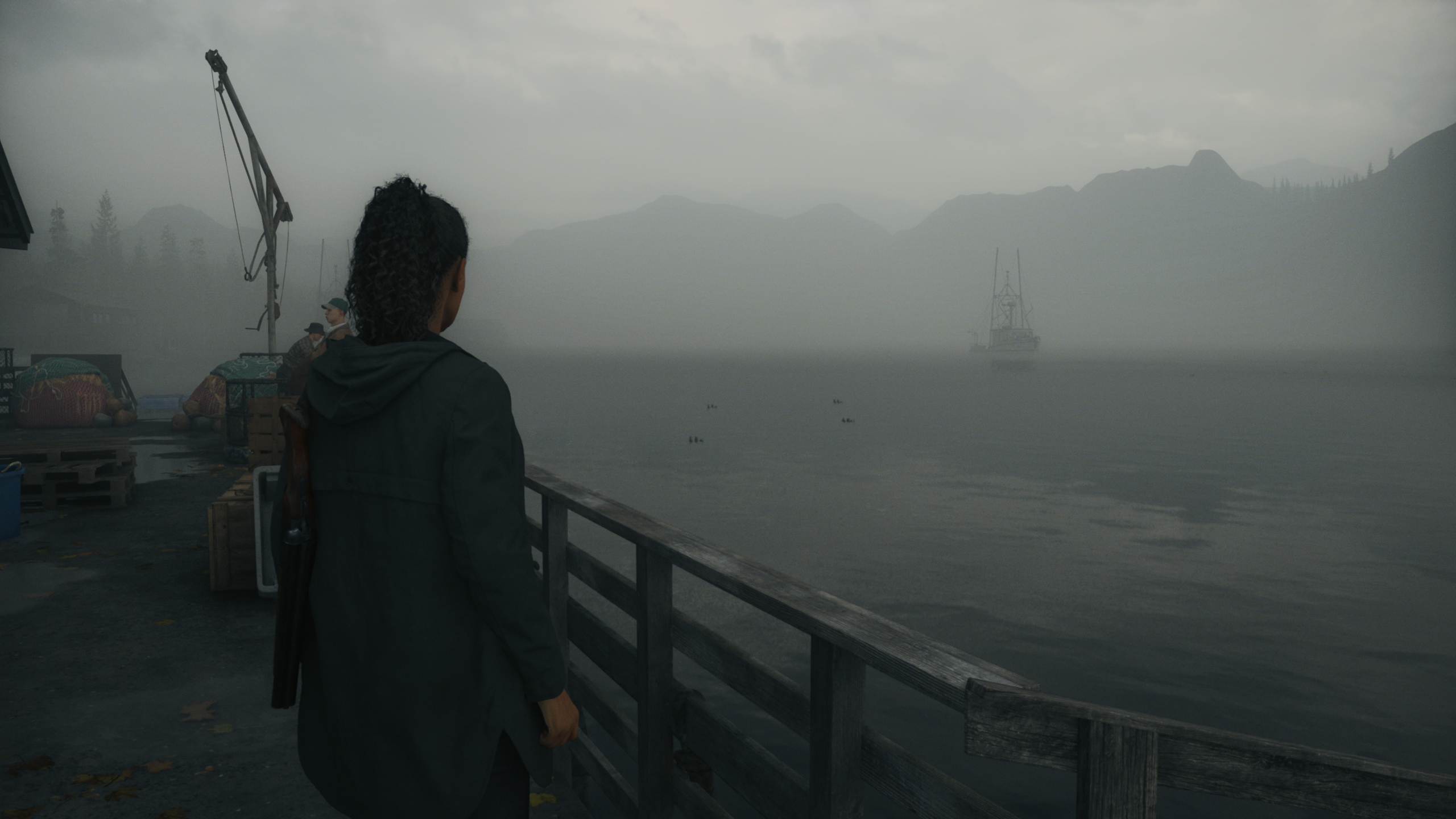 Alan Wake 2 - Saga looks out over a foggy lake