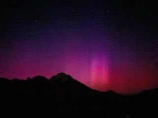 Aurora in Southern California glows red and pink.