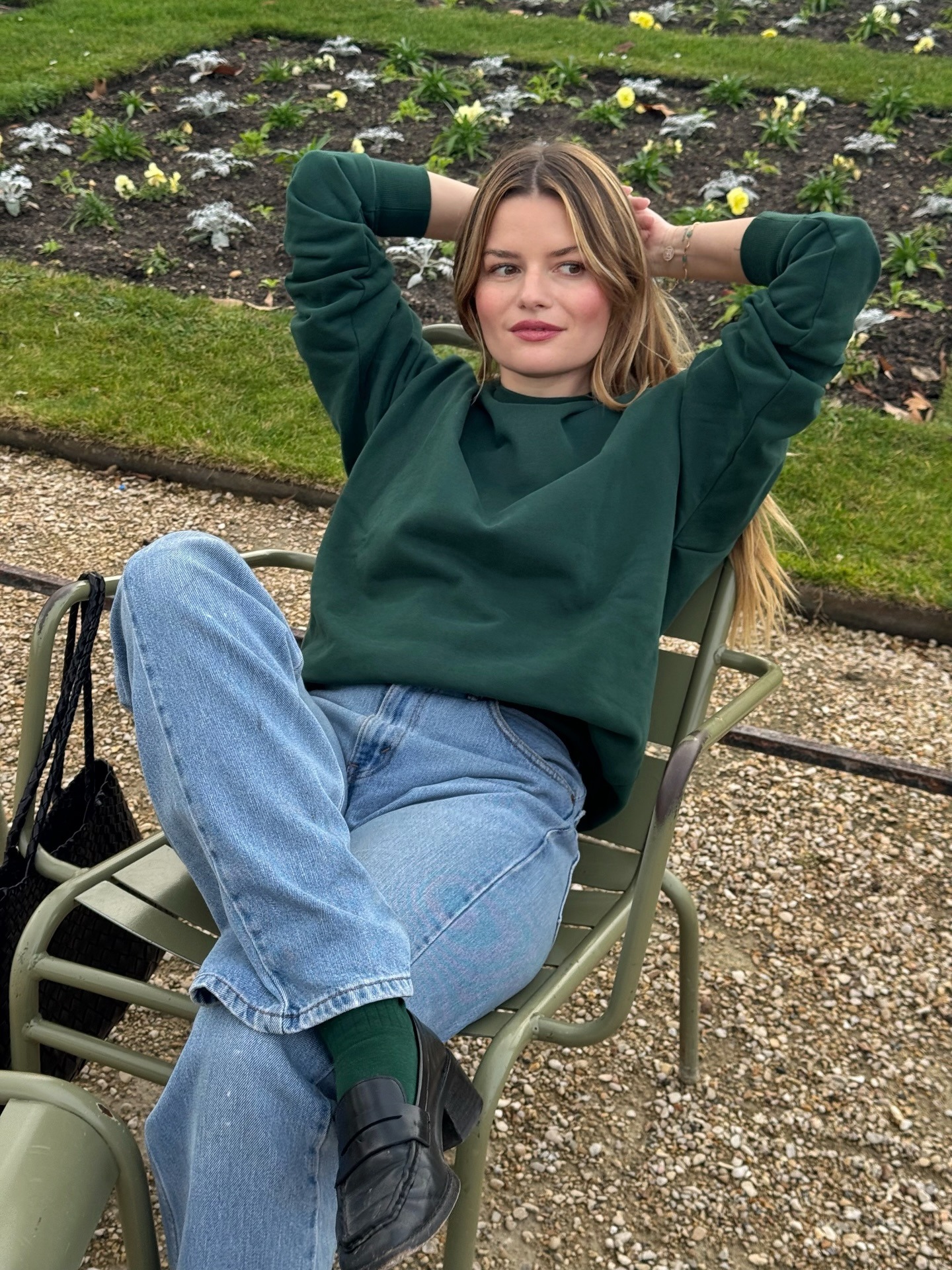 French woman wearing mid-wash straight-leg jeans in Paris.