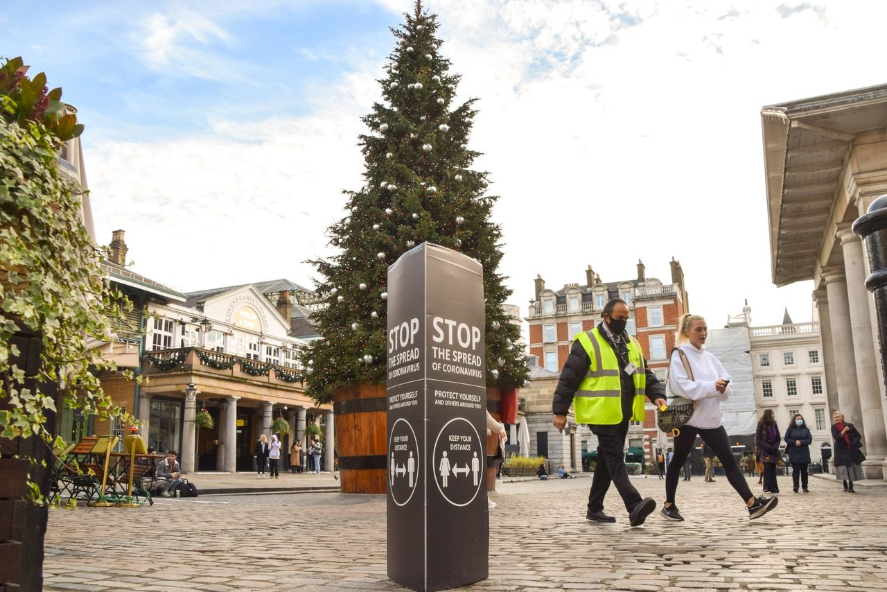 christmas tree in Covent Garden, London, just days before the tiers are announced for England