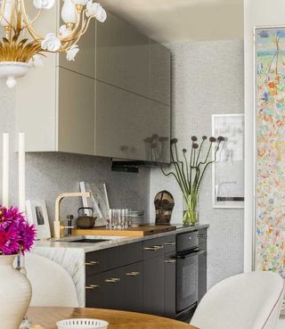 a small kitchen idea with gloss grey and cream cabinets