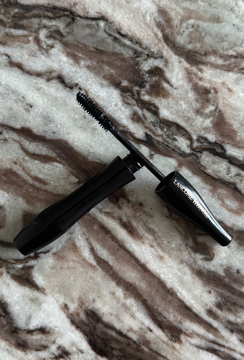 Lancome Hypnose mascara wand and brush on a marble table