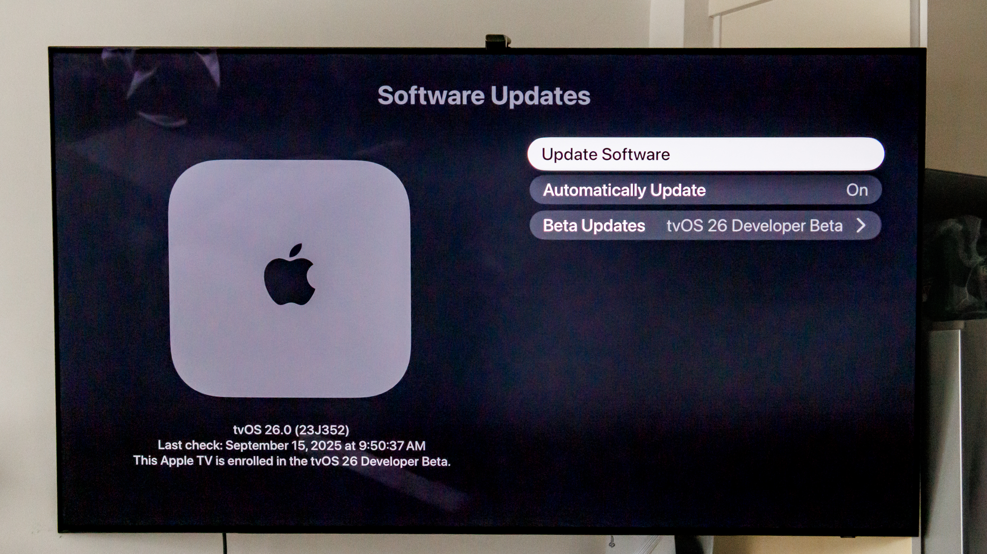 Apple tvOS 26 download screen