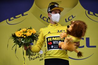 Team Jumbo rider Slovenias Primoz Roglic celebrates his overall leader yellow jersey on the podium at the end of the 9th stage of the 107th edition of the Tour de France cycling race 154 km between Pau and Laruns on September 6 2020 Photo by Marco Bertorello POOL AFP Photo by MARCO BERTORELLOPOOLAFP via Getty Images
